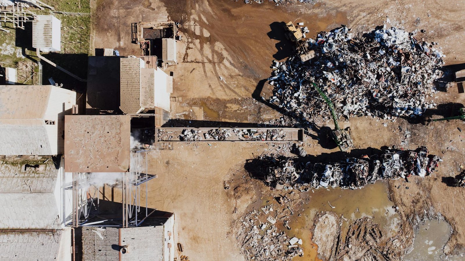 Aerial shot of a recycling yard with piles of scrap metal and waste in Chattanooga.